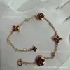 V dourado versão alta L família burro losango pulseira redonda quatro flores madrepérola branca madrepérola rosa fábrica de origem transmissão ao vivo pegar mercadorias