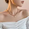 Collar artístico con colgante de piedra ojo de gato estilo retro francés para mujer, moderno, de lujo ligero, alta gama, versátil para otoño e invierno, cadena para suéter