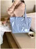 Bolsa de ombro única feminina design de nicho senso de estilo couro macio bolsa feminina grande capacidade para o dia a dia temperamento bolsa tote simples feminina transfronteiriça