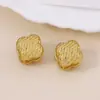 Vintage vintage simple tejido repujado patrón trébol de cuatro hojas hebilla de oreja moda tridimensional diario