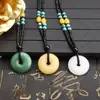 Actividad regalo pequeño Regalo puesto de collares collar de jade sintético al por mayor colgante de hebilla de paz cadena para suéter colgante de jade colgante