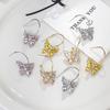 Pendientes de mariposa huecos con diamantes de lujo, de moda coreana, de plata S925, sencillos y elegantes de alta gama.