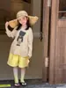 2026 Novo Estilo de Verão Estilo Coreano Leves e Frescas Camisetas com Proteção Solar para Meninos e Meninas com Estampas de Desenho Animado e Tops Versáteis