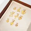 Colgante de trébol de cuatro hojas en forma de corazón de acero inoxidable con chapado en oro de 18 quilates, de alta gama, que conserva el color, superventas transfronterizo