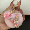 Suministra y Vende Llaveros con Alfabeto de 26 Letras en Forma de Corazón de Colores con Pompoms y Borlas, Colgantes para Llaves para Bolsos de Mujer