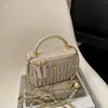 Bolso tipo caja de bola dorada pequeña con cadena plisada estilo Chanel modelo nuevo 2026 bolso de hombro para maquillaje bordado bolso cruzado