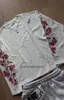 Moletom redondo europeu e americano ins transfronteiriço personalizado com bordado floral, camiseta de manga comprida, jaqueta corta-vento vintage, moda de rua