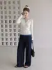 Top de capa base de punto blanco de dos piezas estilo coreano con mangas largas, colección otoño 2026, bloques de color, hombro normal, cuello en V, para mujer