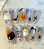 Uñas vestibles de Halloween superventas transfronterizas europeas y americanas, piezas de arte de uñas de calabaza, calavera y fantasma puramente hechas a mano, productos terminados para venta al por mayor de alta gama