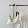 Bolso de Mujer Estilo Coreano 2026 Verano Nuevo Modelo Bolso de Hombro Texturizado Bolso Cruzado para el Trabajo Casual Bolso Cubo de Comercio Exterior Transfronterizo
