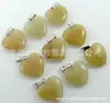 Europa y Estados Unidos venta caliente Piedra Ojo de Gato Colgante de Amor piedra natural cristal ágata colgante corazón de melocotón collar accesorios DIY al por mayor