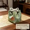 Brocado de canción nuevo diseño, bolsa de almacenamiento creativa hecha a mano anti-caída para juego de té, organizador de juego de té retro de nuevo estilo chino, bolsa de tela para taza de té