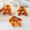 Cabeza de Orquídea Cymbidium Simulada Accesorios Táctiles Pasador Recuerdo de Boda Diseño de Fondo Arreglo Floral DIY Fabricante Mayorista
