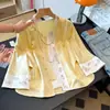 Calidad garantizada, seda, reduce la edad, nueva colección de otoño para mujeres de mediana edad, con un conjunto de chaqueta de cuello redondo bordada en jacquard de estilo chino y pantalones de pierna ancha