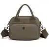 Nova Bolsa de Nylon Fashion Transfronteiriça Nova Versão Coreana Multicamadas com Zíper Tendência Versátil Bolsa de Mão Casual Feminina Atacado