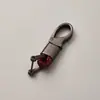 Directo de fábrica llavero de cuerda tejida accesorios de ferretería hebilla de herradura colgante para llave de coche accesorios de coche de moda