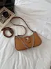 Bolso de ante para mujer bajo el brazo, nuevo modelo de moda de verano 2026, sensación de alta gama, versátil para el uso diario, bolso de hombro y cruzado