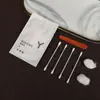 Set de Cepillos de Dientes Desechables para Habitaciones de Hotel y Casas de Huéspedes, Hecho de Materiales Ecológicos Como Papel de Piedra Li Feng, con Diseño Sellado por Tres Lados, Incluye Peine y Navaja