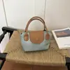 Bolso de mano cuadrado pequeño estilo fresco y dulce al por mayor para mujer, nuevo modelo de verano 2026, bolso de hombro con bloques de color, bolso cruzado de moda