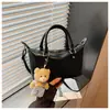 Bolsa Feminina de Luxo 2026 Nova Tendência Moda Primavera Versátil Bolsa de Ombro para Trabalho e Deslocamento Bolsa Transversal Almofadada