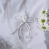 Llavero Colgante de Nudo de Lazo con Pedrería Perla Resina Dulce y Elegante Accesorio para Cámara Teléfono Bolso Cadena Versátil