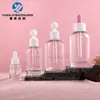 Botellas cuentagotas de vidrio transparente de hombro redondo en stock 10ml-120ml botellas para aceites esenciales botellas dispensadoras de productos para el cuidado de la piel materiales de embalaje