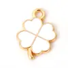 Nuevo color trébol trébol de cuatro hojas gota de aceite accesorios DIY accesorios para joyería llavero colgante para teléfono móvil venta al por mayor