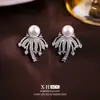 Exquisitos pendientes de perla de fuegos artificiales con circonita brillante, clips para orejas de disco espiral de elegante temperamento francés, pendientes de nicho de alta gama