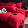 Juego de ropa de cama de cuatro piezas simple y elegante de algodón de fibra larga para bodas, con una funda de edredón roja grande y ropa de cama de algodón puro