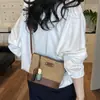 Bolso de playa casual estilo vacacional para mujer, nuevo bolso de paja a rayas de verano 2026, bolso tipo cubo de nicho