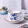 Taza de café y platillo de cerámica estilo retro, flor pintada a mano bajo vidriado, juego de té, taza para el té de la tarde, taza para latte, juego creativo de taza y platillo