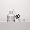 Botella de vidrio de esencia de alta gama de fábrica de origen de 15/20/30 ml con anillo gotero de goma y color de cuerpo de botella opcional.