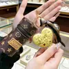 Año del Caballo Oro Puro 999 Llavero de Riqueza Instantánea Bolsa Mini de Oro para Labial Bolsa para Auriculares Colgante Pequeño Regalo Venta al por Mayor