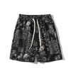 2026 Nuevos Pantalones Cortos Florales para Hombre Estilo Étnico Talla Grande Holgados Casuales Pantalones de Cinco Puntos Cordón Cintura Elástica Pantalones de Playa