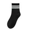 Calcetines de estudiante calcetines infantiles blancos y negros algodón primavera y otoño banda elástica alta caña media color liso uniforme de escuela primaria niños y niñas escuela secundaria niños