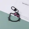 Llavero de cabeza de gato KT hueca dopamina creativo lindo decoración de cabeza de gato colgante de teléfono regalo de pareja pequeño colgante