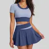 Traje Esportivo de Corrida Juyitang Alta Elasticidade Cor da Pele Color Block Falso Duas Peças Traje Anti-Exposição para Mulheres
