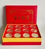 12 peças de 12 peças Medalha de Ouro Qi Baishi 12 peças Cofre de moedas comemorativo do zodíaco chinês venderá presentes