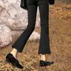Micro-calças pretas femininas 2025 primavera e outono novas explosões pequenas femininas de oito nove Calças jeans boca de sino