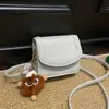2026 Principios de Primavera Nuevo Bolso Cuadrado Pequeño Elegante y de Moda de Color Sólido Único de Alto Valor con Patrón Simple de Lichi, Bolso de Hombro Cruzado