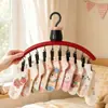Colgador de ropa multi-clip con forma de flor negra para uso doméstico, adecuado para calcetines y ropa interior, herramienta multifuncional pequeña de almacenamiento de ropa