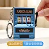 Llavero de máquina de premios modelo nuevo, mini colgante de máquina de juegos de frutas electrochapado, colgante de bolsa de juguete de máquina de sacudir retro