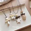 Nuevo collar retro estilo chino de piedra acrílica con estrella, cadena para suéter de nicho de verano de alta gama, accesorio moderno y versátil