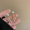 Aretes largos de moño rosa dulce fresco Perla aretes dulces elegantes de dos piezas diseño de nicho femenino