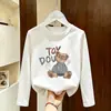Camiseta casual de algodón puro para niñas, cuello redondo, manga larga, nuevo estilo fino de primavera y otoño 2026, top versátil de dibujos animados para niños mayores