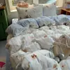 Conjunto de cama de quatro peças Classe A para mães e bebês, lençol de algodão lavado imitação de algodão antibacteriano, capa de edredom, lençol com elástico, conjunto de três-quatro peças para dormitório de estudante individual