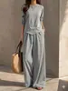Elegante traje casual para mujer 2026 primavera y otoño nuevo estilo top irregular de cuello redondo pantalones de pierna ancha de cintura alta conjunto de dos piezas para mujer