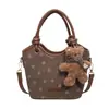 Bolso Cubo Retro de Ante 2026 Otoño/Invierno Nuevo Bolso de Mano Personalidad Corazón Moda Elegante Bolso de Hombro Único Cruzado