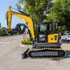 Exportado a Rusia: Excavadora de Ingeniería sobre Orugas Ht65, Excavadora de Construcción Multifuncional con Martillo Rompedor y Barrena Helicoidal