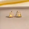Pendientes de cobre con incrustaciones de diamantes, los más vendidos transfronterizos europeos y americanos, pendientes de botón exquisitos y únicos de celebridad de internet retro para mujer, versátiles y de alta gama